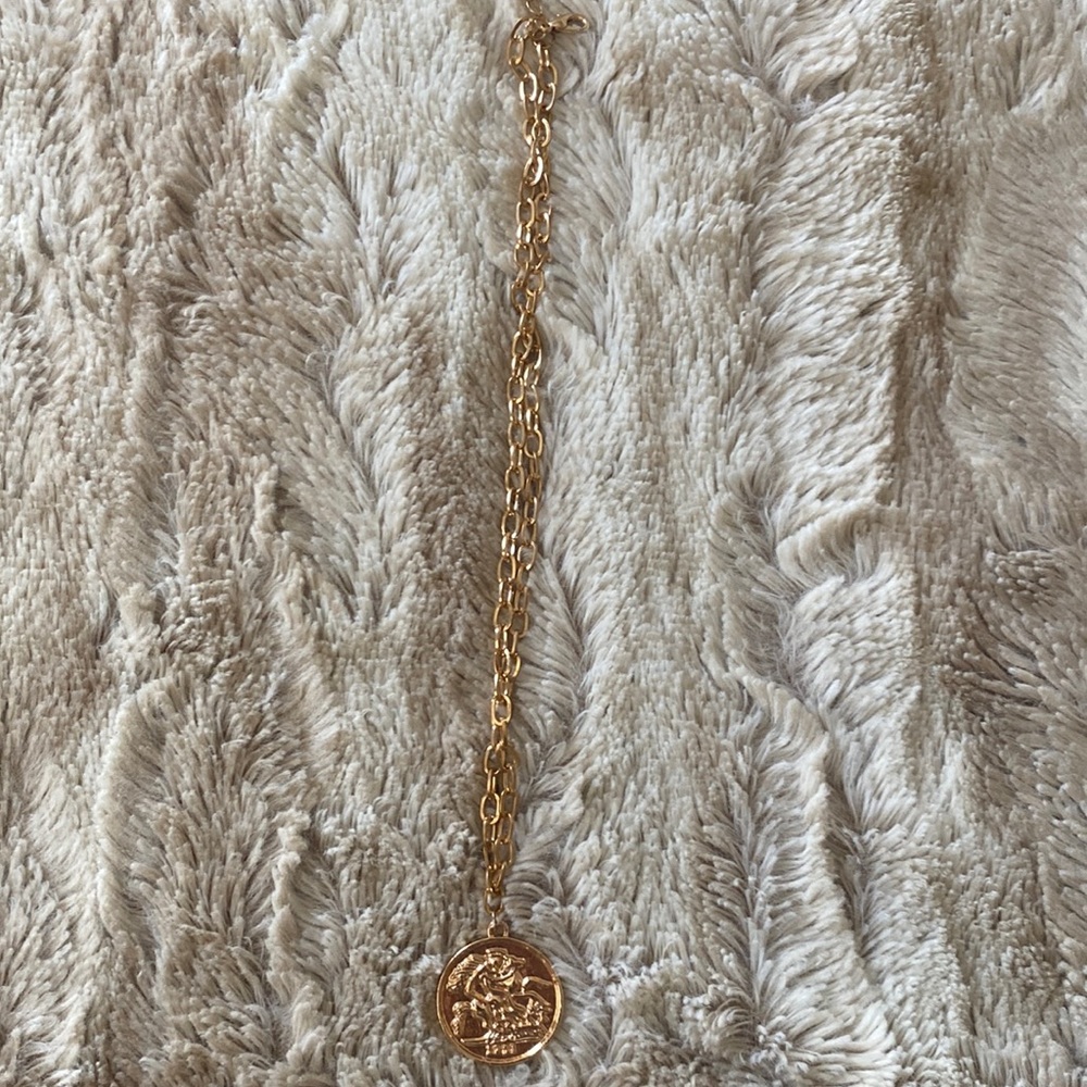 Simple gold necklace with coin